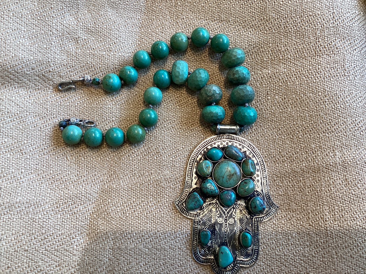 Green turquoise Hand of Hamsa necklace by Dallas