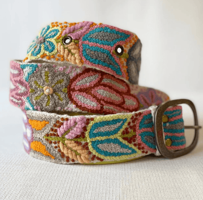Colorful embroidered belt with floral patterns on a light background